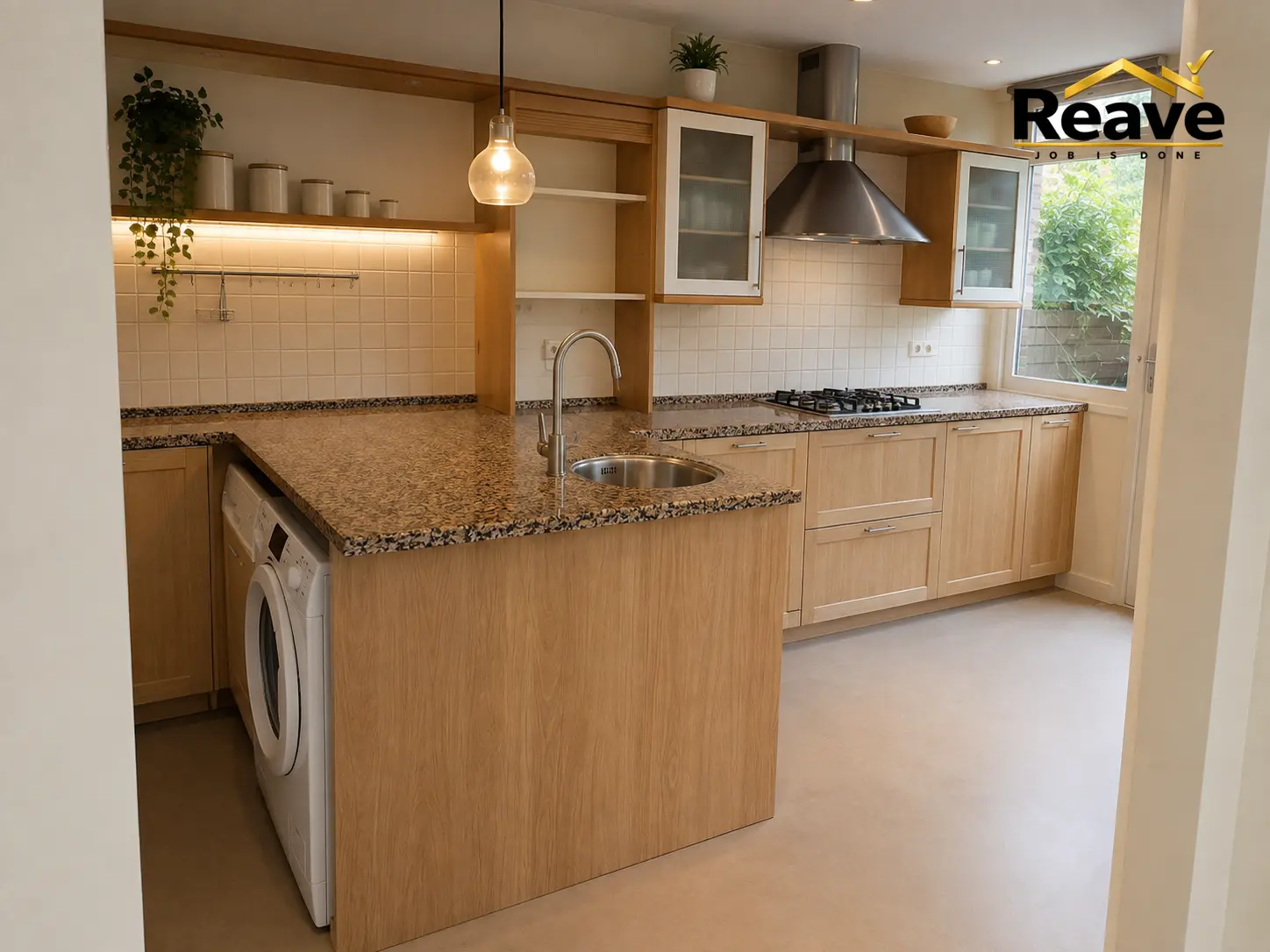Light oak kitchen with speckled granite worktop and peninsula