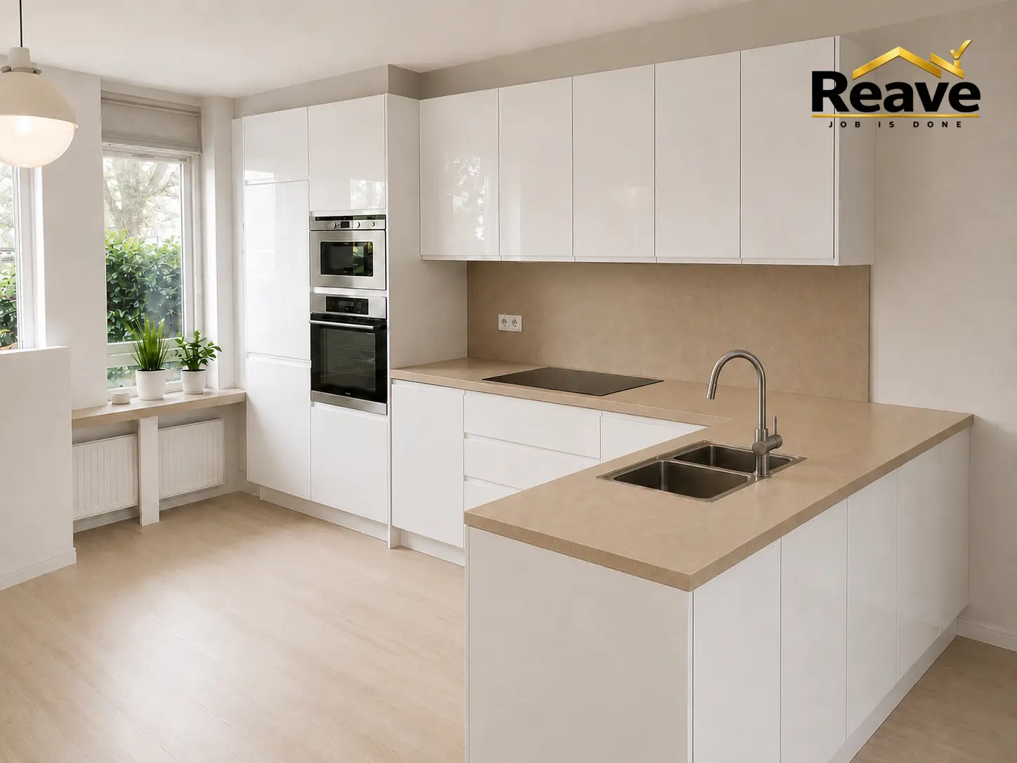White gloss U-shaped kitchen with beige worktop and built-in double oven