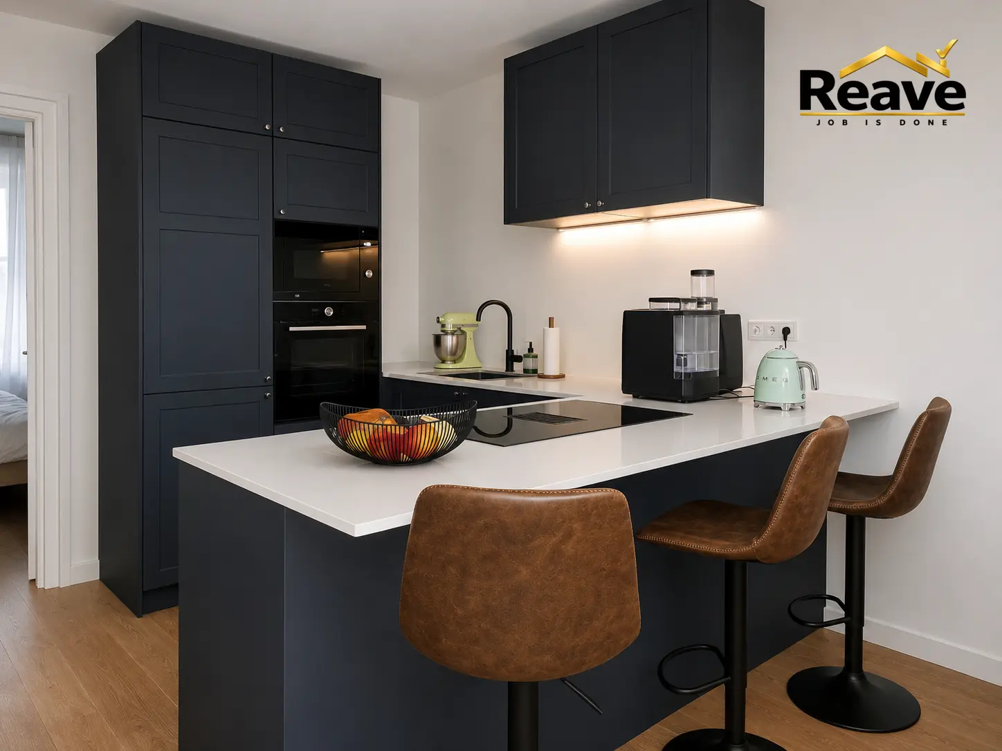 Navy shaker kitchen with white worktop breakfast bar and leather bar stools